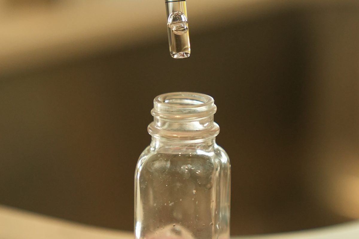 Reagent drops added to a water sample during a free hardness test